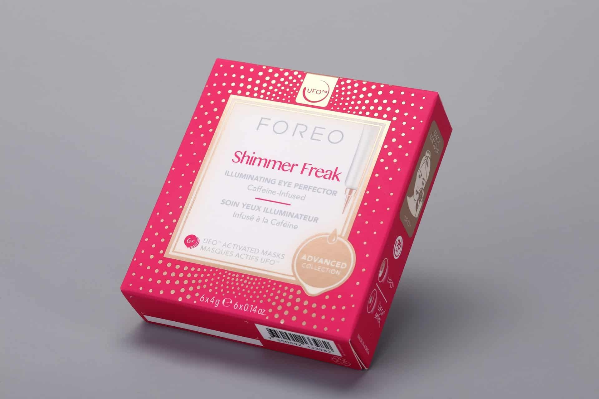 This is a custom-designed box with a vibrant red and pink color scheme, embellished with gold dot accents. It is specifically crafted to hold caffeine-infused eye masks from the Foreo Shimmer Freak Advanced Collection.